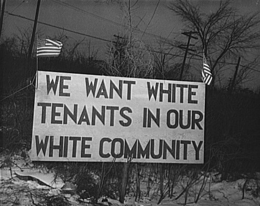 gentrification racial segregation sign